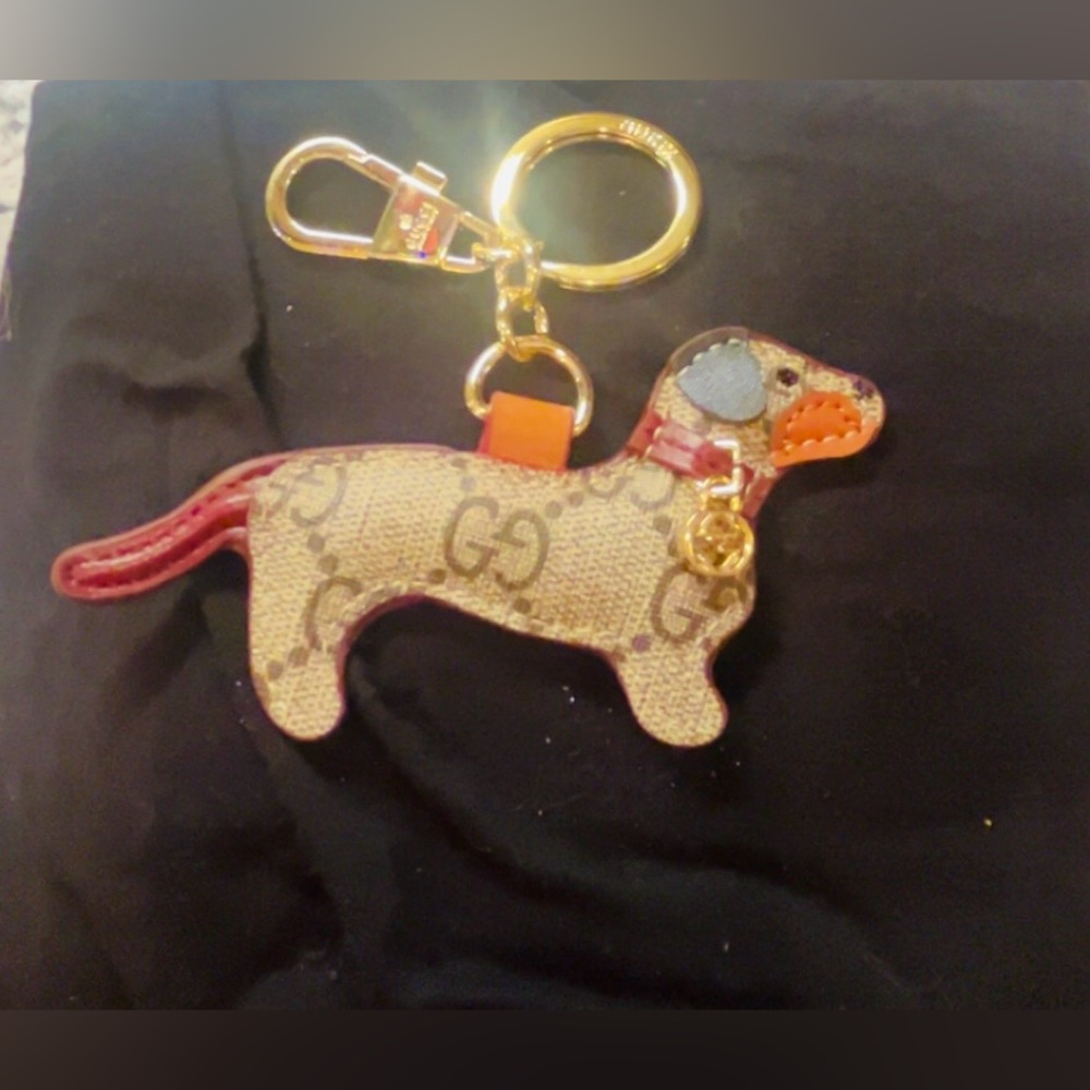 Adorable Gucci Monogram GG Dog Shaped Keychain with Gold Accents